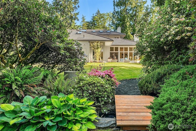 12909 Spanaway Loop Rd S, Tacoma, WA 98444 - view of green lawn with a sunroom