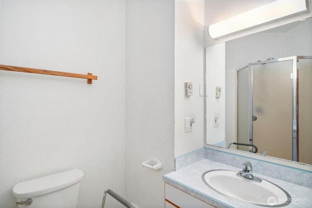 145 E Falcon Ct, Shelton, WA 98584 - bathroom with toilet, vanity, and a shower stall