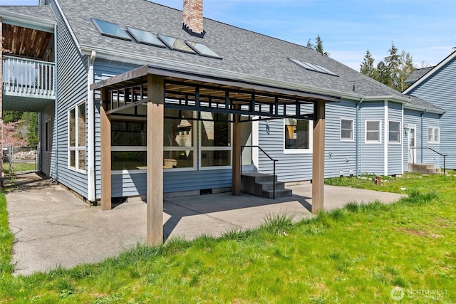 145 E Falcon Ct, Shelton, WA 98584 - rear view of house with a shingled roof, a chimney, a patio, a yard, and crawl space