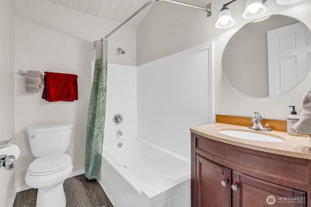 411 7th St SE, Auburn, WA 98002 - bathroom with vanity, toilet, shower / tub combo with curtain, wood finished floors, and baseboards