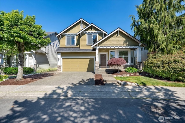 4844 Bridgeport Pl, Mukilteo, WA 98285 - craftsman-style house with driveway, stone siding, and a garage