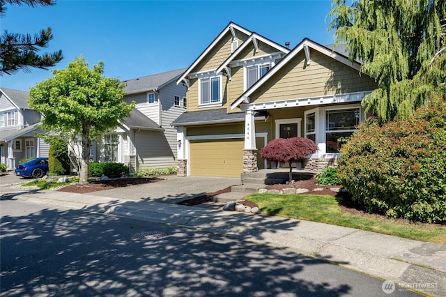 4844 Bridgeport Pl, Mukilteo, WA 98285 - craftsman house with concrete driveway, stone siding, and a garage
