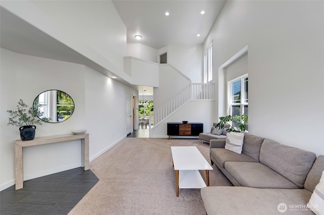 4844 Bridgeport Pl, Mukilteo, WA 98285 - living area with stairway, recessed lighting, a towering ceiling, and baseboards
