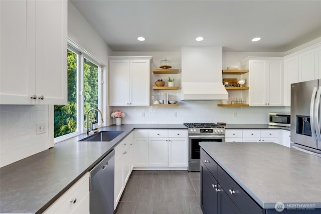 4844 Bridgeport Pl, Mukilteo, WA 98285 - kitchen with open shelves, appliances with stainless steel finishes, a sink, custom exhaust hood, and recessed lighting