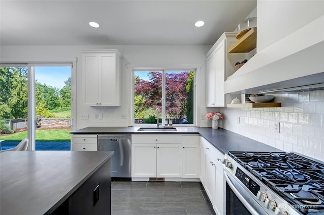 4844 Bridgeport Pl, Mukilteo, WA 98285 - kitchen with open shelves, appliances with stainless steel finishes, exhaust hood, a sink, and white cabinetry