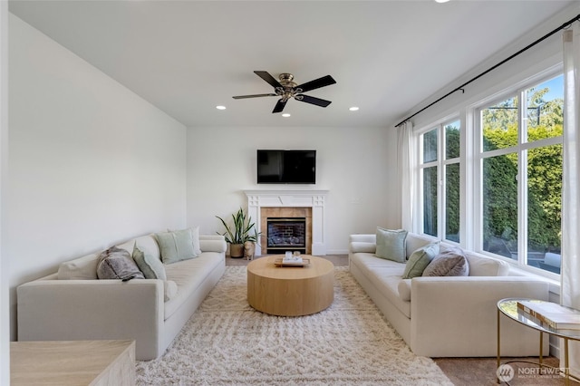 4844 Bridgeport Pl, Mukilteo, WA 98285 - living area featuring a ceiling fan, recessed lighting, and a premium fireplace