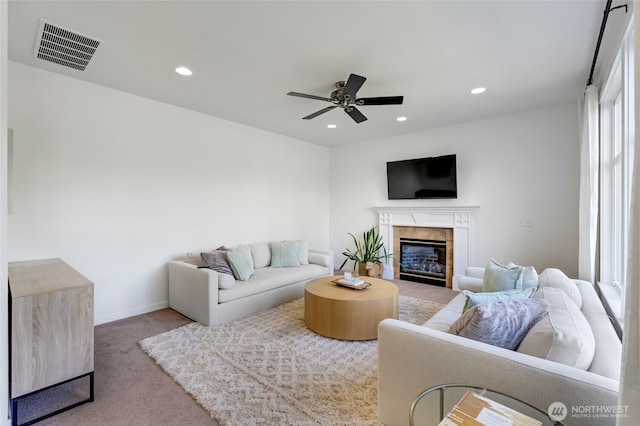 4844 Bridgeport Pl, Mukilteo, WA 98285 - living area featuring carpet, a high end fireplace, a ceiling fan, recessed lighting, and baseboards