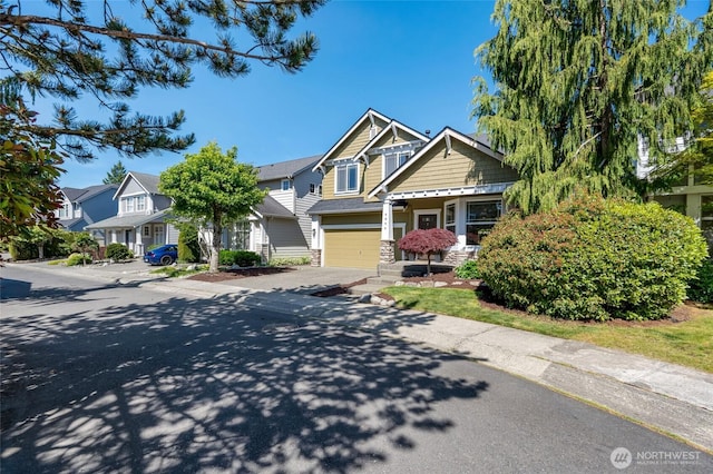 4844 Bridgeport Pl, Mukilteo, WA 98285 - view of front facade featuring driveway, a garage, and a residential view