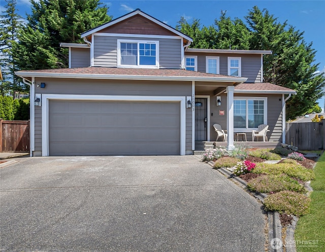 20003 13th Avenue Ct E, Spanaway, WA 98387 - traditional home featuring an attached garage, driveway, and a porch
