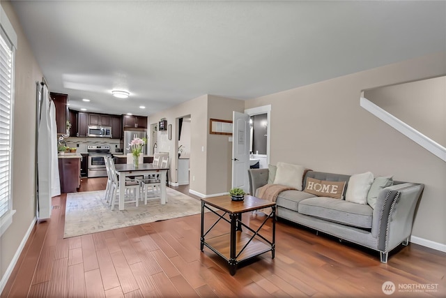 20003 13th Avenue Ct E, Spanaway, WA 98387 - living area with dark wood-style flooring and baseboards