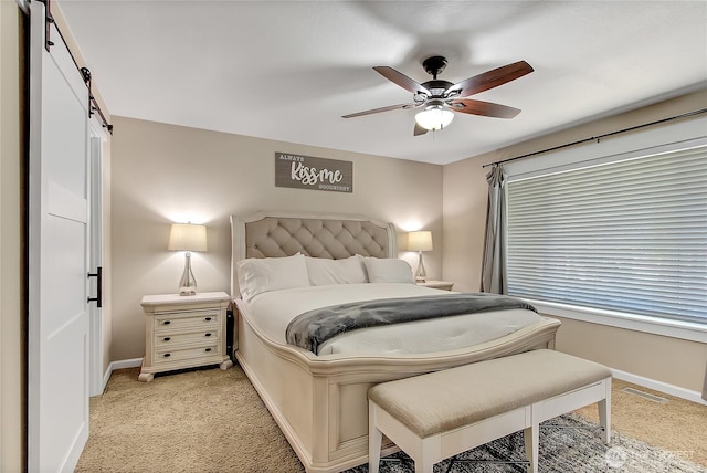 20003 13th Avenue Ct E, Spanaway, WA 98387 - bedroom with a barn door, light carpet, baseboards, and ceiling fan