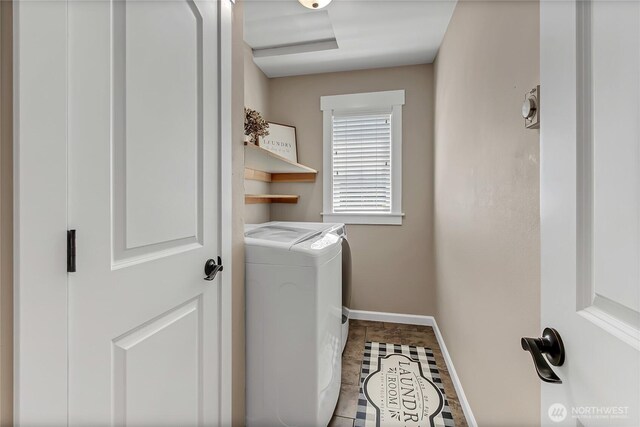 20003 13th Avenue Ct E, Spanaway, WA 98387 - washroom with independent washer and dryer, baseboards, and tile patterned floors