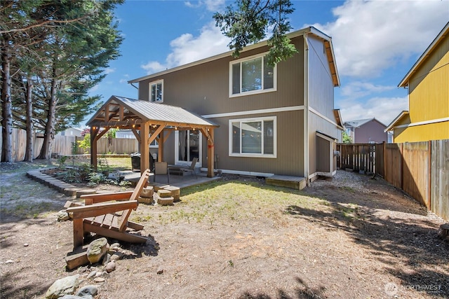 20003 13th Avenue Ct E, Spanaway, WA 98387 - rear view of house featuring a gazebo, a patio, and a fenced backyard