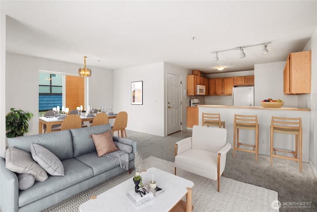 1733 NW 59th St Unit 201, Seattle, WA 98107 - living room with a chandelier and light carpet