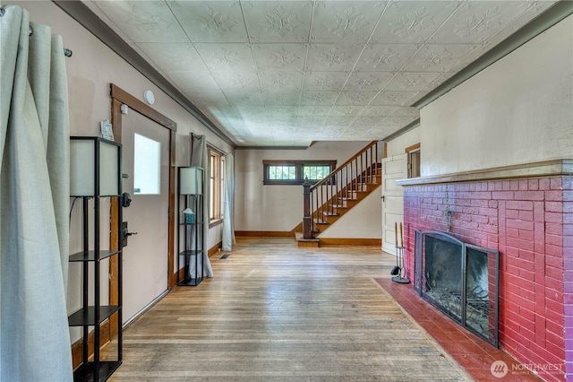 2150 N Callow Ave, Bremerton, WA 98312 - foyer featuring wood finished floors, an ornate ceiling, a fireplace, baseboards, and stairs