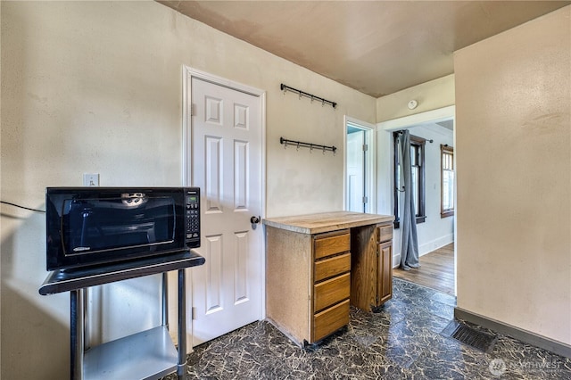 2150 N Callow Ave, Bremerton, WA 98312 - kitchen featuring brown cabinets, light countertops, and baseboards
