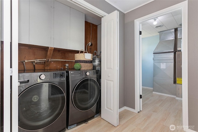 1669 Grandview Pl, Ferndale, WA 98248 - laundry area with light wood finished floors, baseboards, and washing machine and dryer