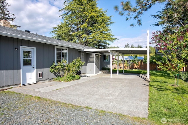 1669 Grandview Pl, Ferndale, WA 98248 - rear view of property featuring concrete driveway, a shingled roof, and a carport