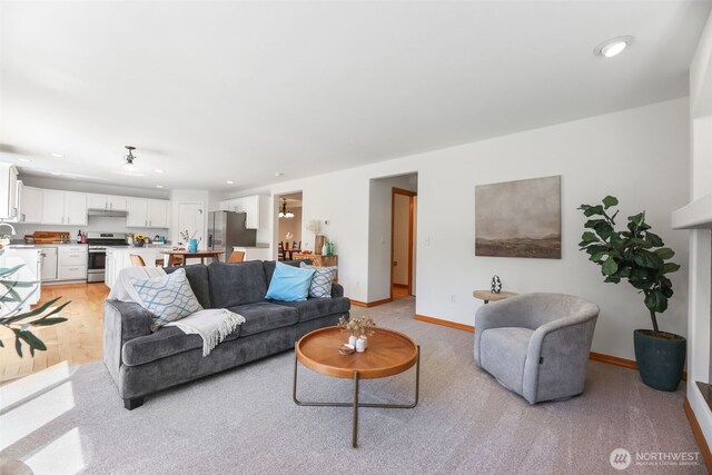 11724 1st Pl SE, Lake Stevens, WA 98258 - living area featuring recessed lighting, baseboards, and light carpet