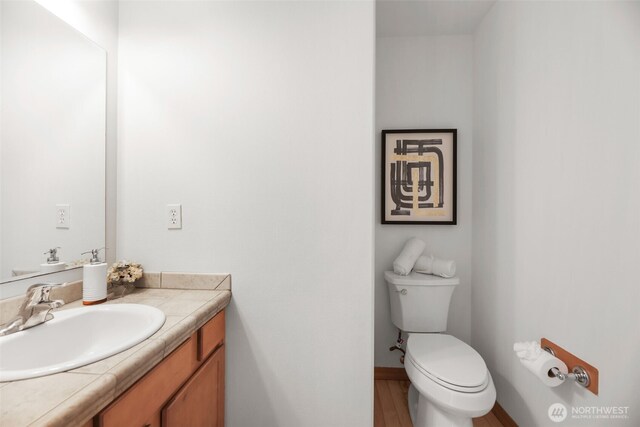 11724 1st Pl SE, Lake Stevens, WA 98258 - bathroom featuring vanity, toilet, and baseboards