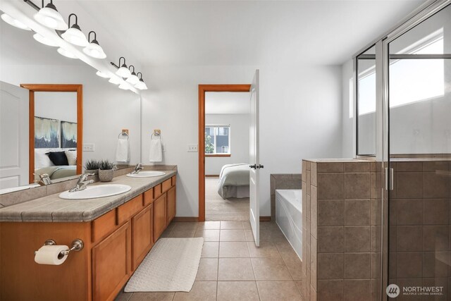 11724 1st Pl SE, Lake Stevens, WA 98258 - full bathroom featuring ensuite bathroom, double vanity, a bath, and tile patterned flooring