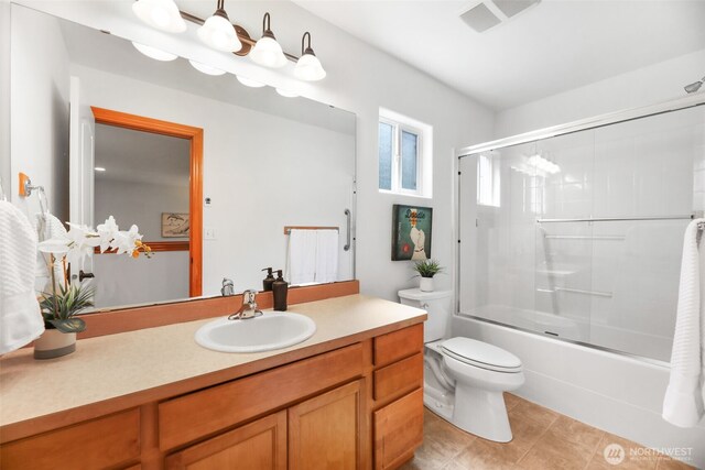 11724 1st Pl SE, Lake Stevens, WA 98258 - full bath with vanity, toilet, shower / bath combination with glass door, and tile patterned floors