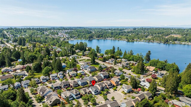 11724 1st Pl SE, Lake Stevens, WA 98258 - aerial view of property's location featuring a nearby body of water, nearby suburban area, and a heavily wooded area