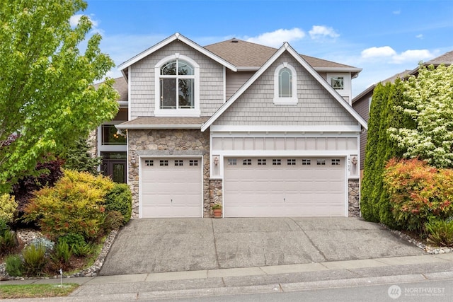 4105 215th St SE, Bothell, WA 98021 - craftsman inspired home with stone siding, driveway, a garage, and roof with shingles