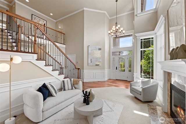 4105 215th St SE, Bothell, WA 98021 - living room with a towering ceiling, stairs, a fireplace, a chandelier, and recessed lighting
