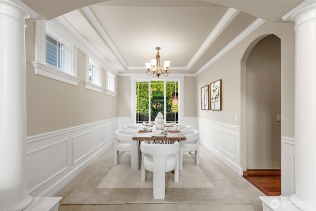 4105 215th St SE, Bothell, WA 98021 - dining area with a decorative wall, a wainscoted wall, a chandelier, arched walkways, and ornamental molding