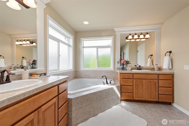 4105 215th St SE, Bothell, WA 98021 - bathroom with two vanities, a garden tub, and tile patterned flooring