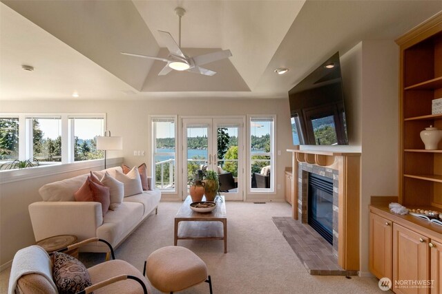1653 204th Ave NE, Sammamish, WA 98074 - living room featuring light colored carpet, recessed lighting, a fireplace, a ceiling fan, and vaulted ceiling