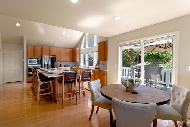 1653 204th Ave NE, Sammamish, WA 98074 - dining space featuring light wood-style flooring, vaulted ceiling, and recessed lighting