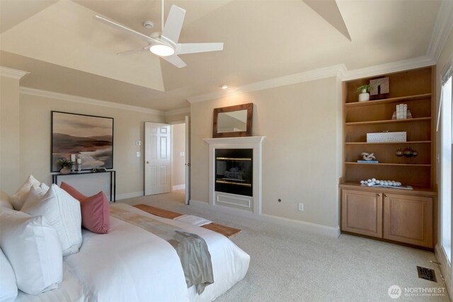 1653 204th Ave NE, Sammamish, WA 98074 - bedroom with a glass covered fireplace, ornamental molding, light colored carpet, ceiling fan, and baseboards