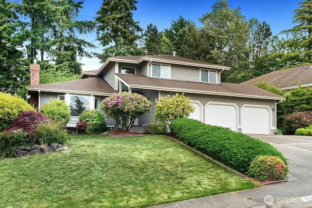 1112 SW 326th Pl, Federal Way, WA 98023 - view of front facade with asphalt driveway, a front lawn, a garage, and a chimney
