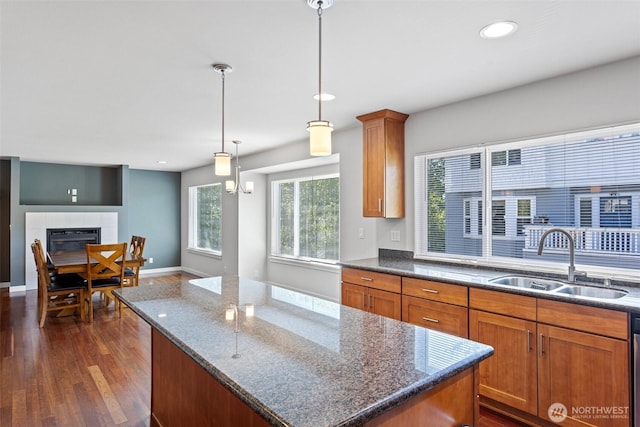 1120 156th Ave SE, Bellevue, WA 98007 - kitchen with a sink, a kitchen island, dark wood finished floors, brown cabinetry, and recessed lighting