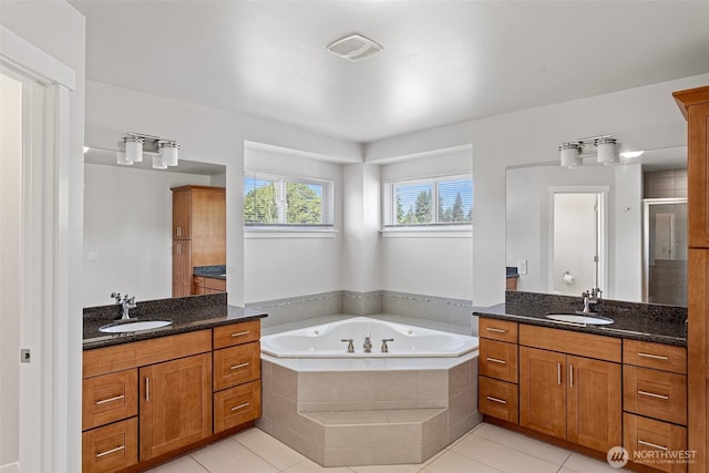 1120 156th Ave SE, Bellevue, WA 98007 - bathroom with a shower stall, two vanities, a bath, and tile patterned floors