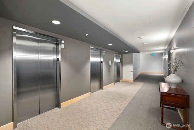 10650 NE 9th Pl Unit 3210, Bellevue, WA 98004 - corridor featuring elevator, baseboards, light colored carpet, and recessed lighting