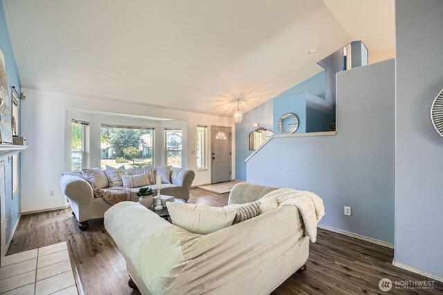 7116 193rd St E, Spanaway, WA 98387 - living room with vaulted ceiling and wood finished floors