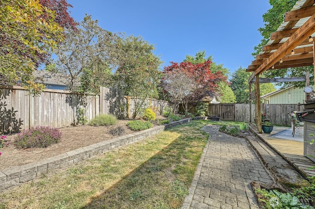 7116 193rd St E, Spanaway, WA 98387 - fenced backyard featuring a deck and a pergola