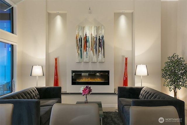 2021 1st Ave Unit G4, Seattle, WA 98121 - living area featuring baseboards and a glass covered fireplace