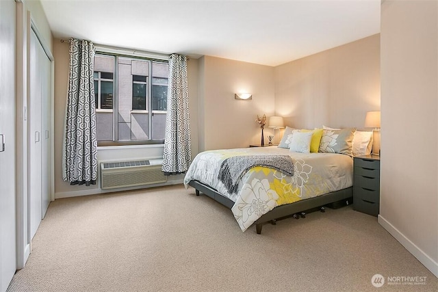 2021 1st Ave Unit G4, Seattle, WA 98121 - bedroom featuring carpet, a wall unit AC, and baseboards