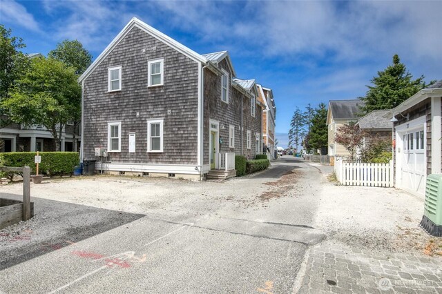 38 W Myrtle Ln, Pacific Beach, WA 98571 - view of side of home featuring asphalt driveway, cooling unit, and a cooling unit