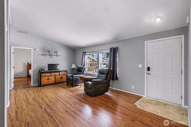 6350 Portal Way Unit 75, Ferndale, WA 98248 - living area featuring wood finished floors, lofted ceiling, and baseboards