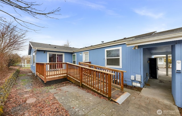 6350 Portal Way Unit 75, Ferndale, WA 98248 - back of property with a deck and a shingled roof