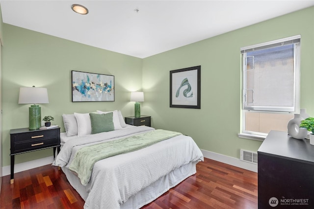 1711 E Olive Way Unit 519, Seattle, WA 98102 - bedroom with baseboards and wood finished floors