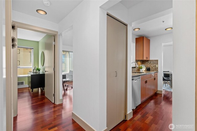 1711 E Olive Way Unit 519, Seattle, WA 98102 - corridor featuring a sink and dark wood-type flooring