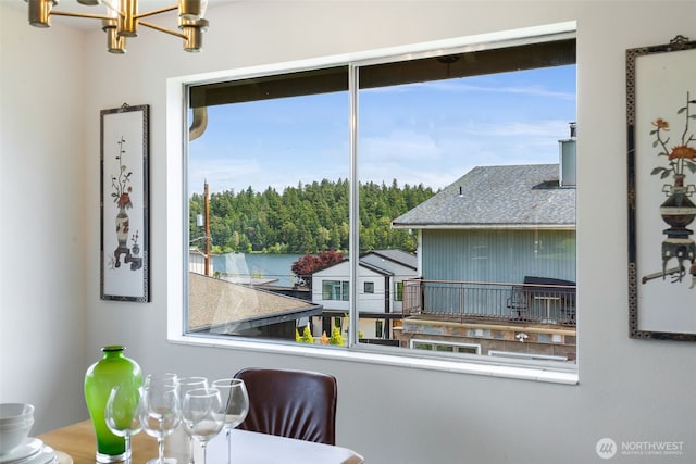 5228 56th Ave S, Seattle, WA 98118 - dining area featuring plenty of natural light, a chandelier, and a water view