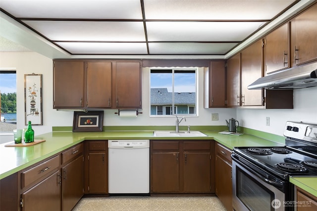 5228 56th Ave S, Seattle, WA 98118 - kitchen with electric range, dishwasher, a sink, under cabinet range hood, and healthy amount of natural light