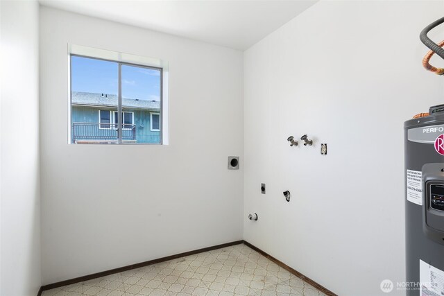 5228 56th Ave S, Seattle, WA 98118 - washroom with hookup for an electric dryer, water heater, light floors, and baseboards